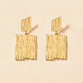 Boucles d’oreilles larges à motifs verticaux