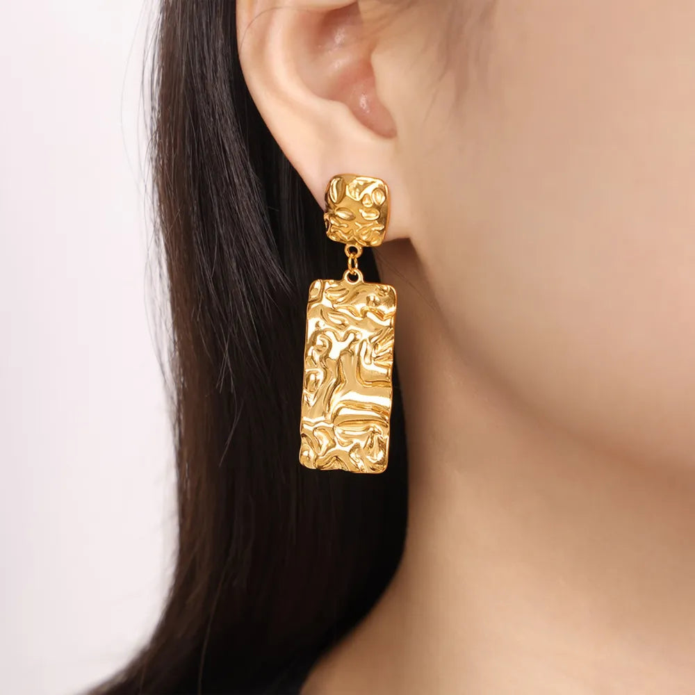 Boucles d’oreilles texturées en Titane Plaqué Or