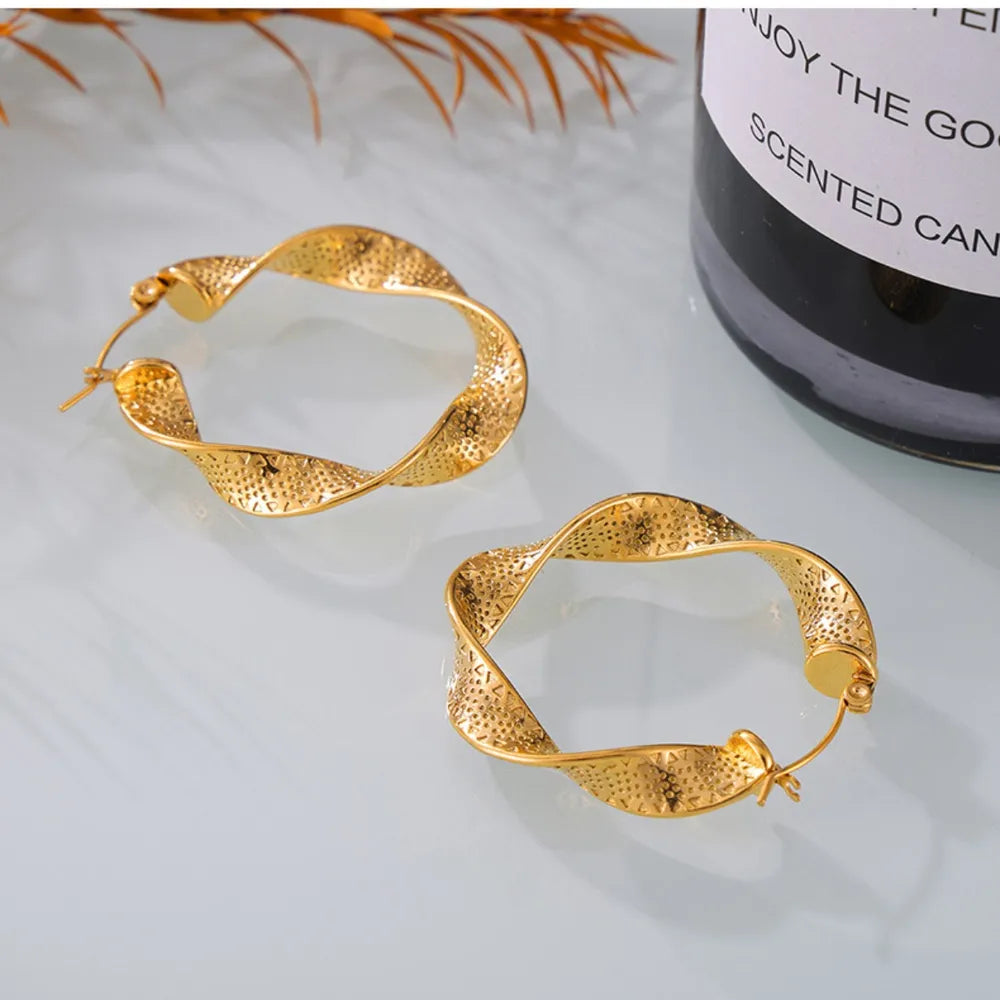 Boucles d’oreilles torsadées en Acier Titane